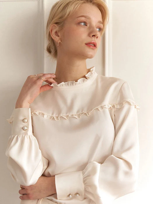 Ivory-colored ruffled satin shirt