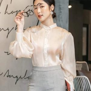 Champagne-colored satin puff sleeve shirt